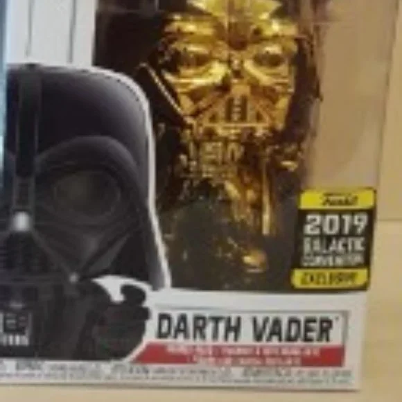 Funko Pop Darth Vader Chrome Gold in the original box.